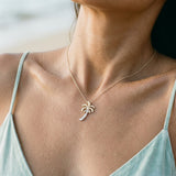 14k 2/tone 20mm Single Palm Tree Pendant with 9 Diamonds — worn on model (brunette, view 3)