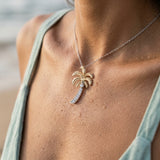 14k 2/tone 20mm Single Palm Tree Pendant with 9 Diamonds — worn on model (brunette, view 4)
