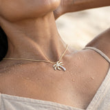 14k 2/tone 15mm Single Palm Tree Pendant with 5 Diamonds — worn on model (brunette, view 3)