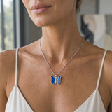14K White Gold Butterfly Pendant — worn on model (blonde, macro close-up)