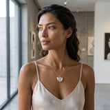 14K Yellow Gold Large Wing Heart Pendant — worn on model (brunette, view 2)