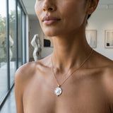 14K Yellow Gold with Diamond Sand Dollar Pendant — worn on model (brunette, view 1)