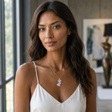 14K Yellow Gold Jellyfish Pendant — worn on model (brunette, view 1)