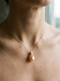 Gold Octopus Pendant With 10mm Peach Fresh Water Pearl & Diamonds — close-up on model