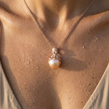 Rose Gold Octopus Pendant With 12mm Peach Fresh Water Pearl & Diamonds — worn on model (brunette, view 4)