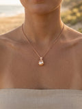 Rose Gold Octopus Pendant With 12mm Peach Fresh Water Pearl & Diamonds — close-up on model