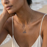14k 20mm Whale Tail Pendant with 34 Blue Sapphires — worn on model (brunette, view 3)