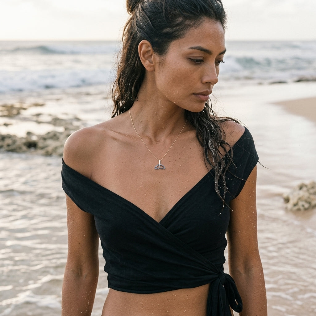 14k 16mm Whale Saw Tail Pendant with 26 Blue Sapphires — worn on model (brunette, view 1)