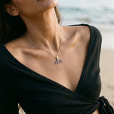 14k 16mm Whale Saw Tail Pendant with 26 Blue Sapphires — worn on model (brunette, view 3)