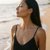 14k 2/tone Manatee Pendant with Diamond and 23 Blue Sapphires — worn on model (brunette, view 1)