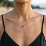 14k 2/tone Manatee Pendant with Diamond and 23 Blue Sapphires — worn on model (brunette, view 3)