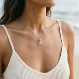 14k Rose Gold Octopus Pendant with 2 Diamonds and 12 Pastel Pink Sapphires — worn on model (brunette, view 3)