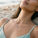14k 2/tone 15mm Dolphin Pendant with 21 Pastel Blue Sapphires — worn on model (brunette, view 3)