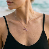 14k Yellow Gold Dolphin Pendant with Diamond and Hot Pink Sapphires — worn on model (blonde, view 3)
