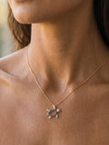 14k 2/tone 12mm "Hawaiian Petroglyph" Honu Pendant with 2 Diamonds and 15 Blue Sapphires — close-up on model