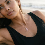 14k Rose Gold Single Sea Horse Pendant with Diamond and 22 Pastel Pink Sapphires — worn on model (brunette, view 3)