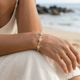 14k Plumeria Bracelet with 6 Diamonds — worn on model (brunette, view 3)