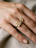 2/tone 14k 8 and 11mm Plumeria Ring — close-up on model
