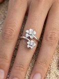 14k 8 and 11mm Plumeria Ring with 2 Diamonds — close-up on model