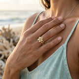 14k 8 and 11mm Plumeria Ring with 2 Diamonds — worn on model (brunette, view 4)