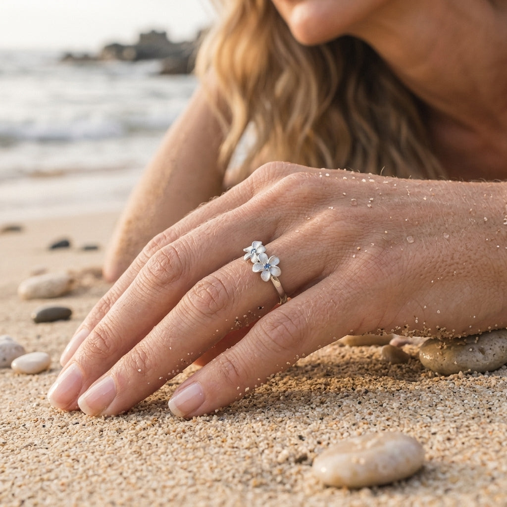 14k White Gold 8mm Plumeria Ring with 3 blue diamonds — worn on model (blonde, view 3)