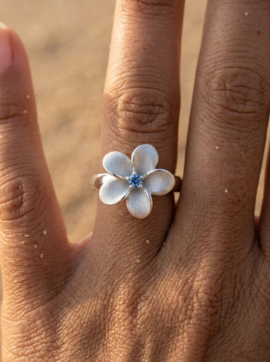 13mm 14k Plumeria Ring with blue diamond