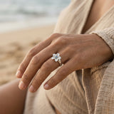 13mm 14k Plumeria Ring with blue diamond — worn on model (brunette, view 3)
