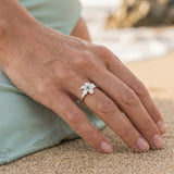 14k 10mm Plumeria Ring with blue diamond — worn on model (blonde, view 3)