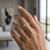 14k 8mm Plumeria Ring with 4 Blue Diamonds — worn on model (brunette, view 2)
