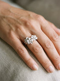 8mm 14k Plumeria Ring with 3 diamonds — close-up on model