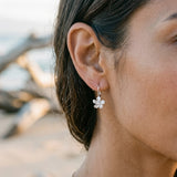 8mm 14kw Plumeria Earrings with 2 diamonds — worn on model (brunette, view 3)