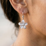 8mm 14kw Plumeria Earrings with 2 diamonds — worn on model (brunette, view 4)