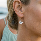 14kw 8mm Plumeria Earrings with 2 blue diamonds — worn on model (blonde, view 4)