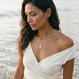 14kw Plumeria Slide Pendant with 3 blue diamonds — worn on model (brunette, view 2)