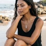 14k Plumeria Lei Slide Pendant with blue diamonds — worn on model (brunette, view 2)