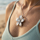 14k 13mm Plumeria Slide with 0.03 carats diamond — worn on model (brunette, view 4)