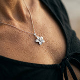 18mm 14k Plumeria Pendant with 0.05 carat diamond — worn on model (blonde, view 4)