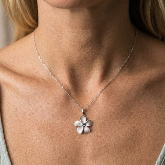 14k 15mm Plumeria Pendant with Blue Diamond