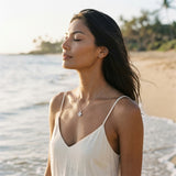 13mm 14k Plumeria Pendant with 0.03 carat diamond — worn on model (brunette, view 2)