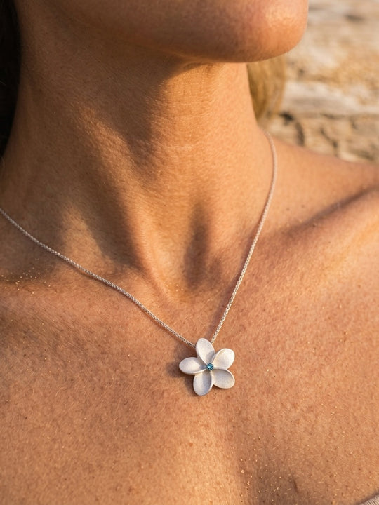 18mm 14k Plumeria Pendant with 0.05 carat blue diamond