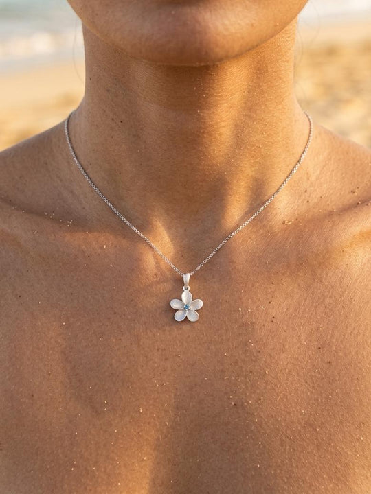 13mm 14k Plumeria Pendant with 0.03 carats blue diamond