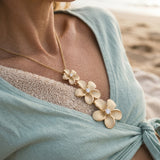 14k Plumeria Lei Slide Pendant with 3 diamonds — worn on model (blonde, view 4)