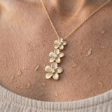 14k 6, 8 & 10mm Plumeria Lei Slide Pendant with 3 diamonds — worn on model (blonde, view 4)