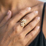 14k 8 and 11mm Plumeria Ring with 2 Diamonds — worn on model (brunette, view 4)