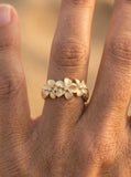 14k 8mm Plumeria Ring with 3 Diamonds — close-up on model
