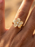 14k 15mm Plumeria Ring with Diamond — close-up on model