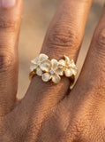 8mm 14k Plumeria Ring with 3 Diamonds — close-up on model