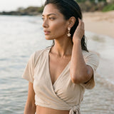 14k Plumeria Earrings with 4 diamonds — worn on model (brunette, view 1)