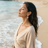 14k Plumeria Earrings with 4 diamonds — worn on model (brunette, view 2)