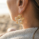 14k 15mm Plumeria Earring with 2 Diamonds — worn on model (blonde, view 4)